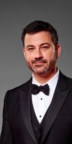 This contain an image of Jimmy Kimmel  on black suit and white inner 