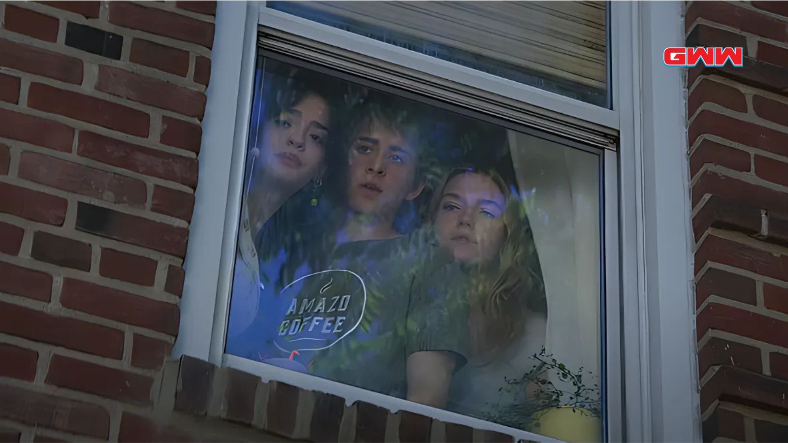 Jayden Bartels, Sam McCarthy, and Galilea La Salvia looking through a window with suspense