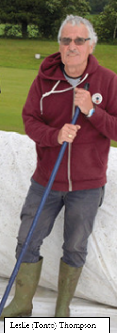 A person holding a broom

Description automatically generated