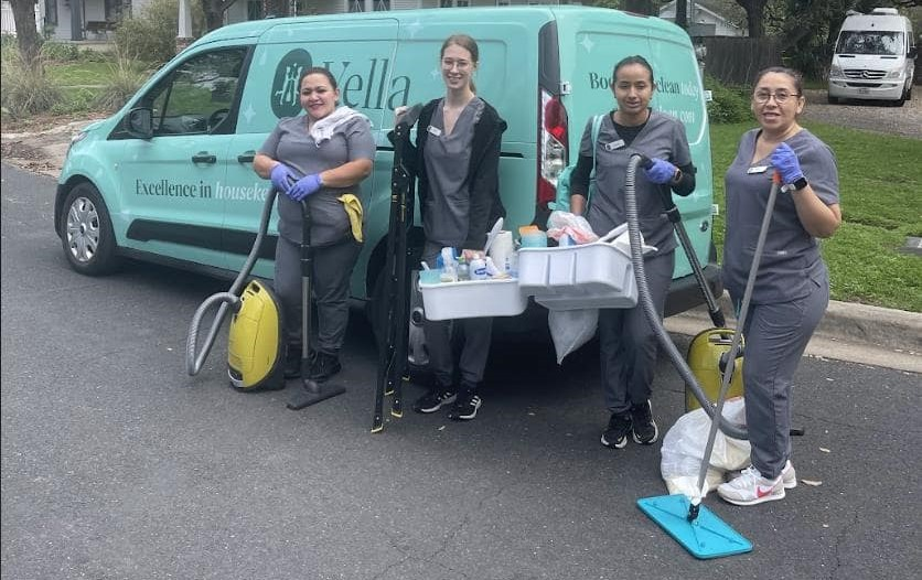 Four Vella housekeepers getting ready to clean an home in Austin.