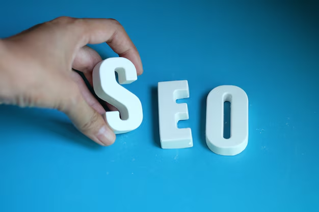 A hand placing the letter S before E and O signifying SEO titles on WordPress