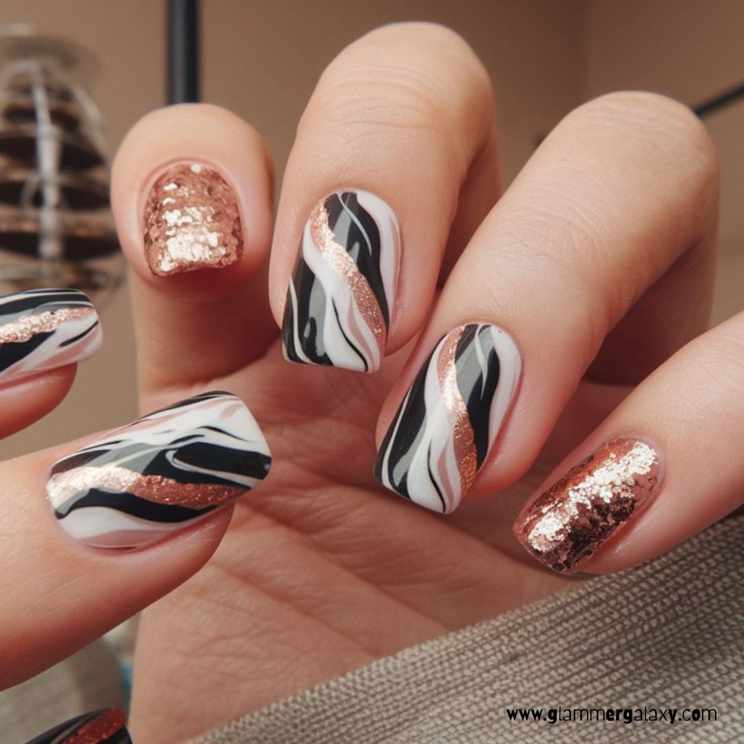 Black and Rose Gold Nail Designs having Marble Nail Art with Black and Rose Gold Details
