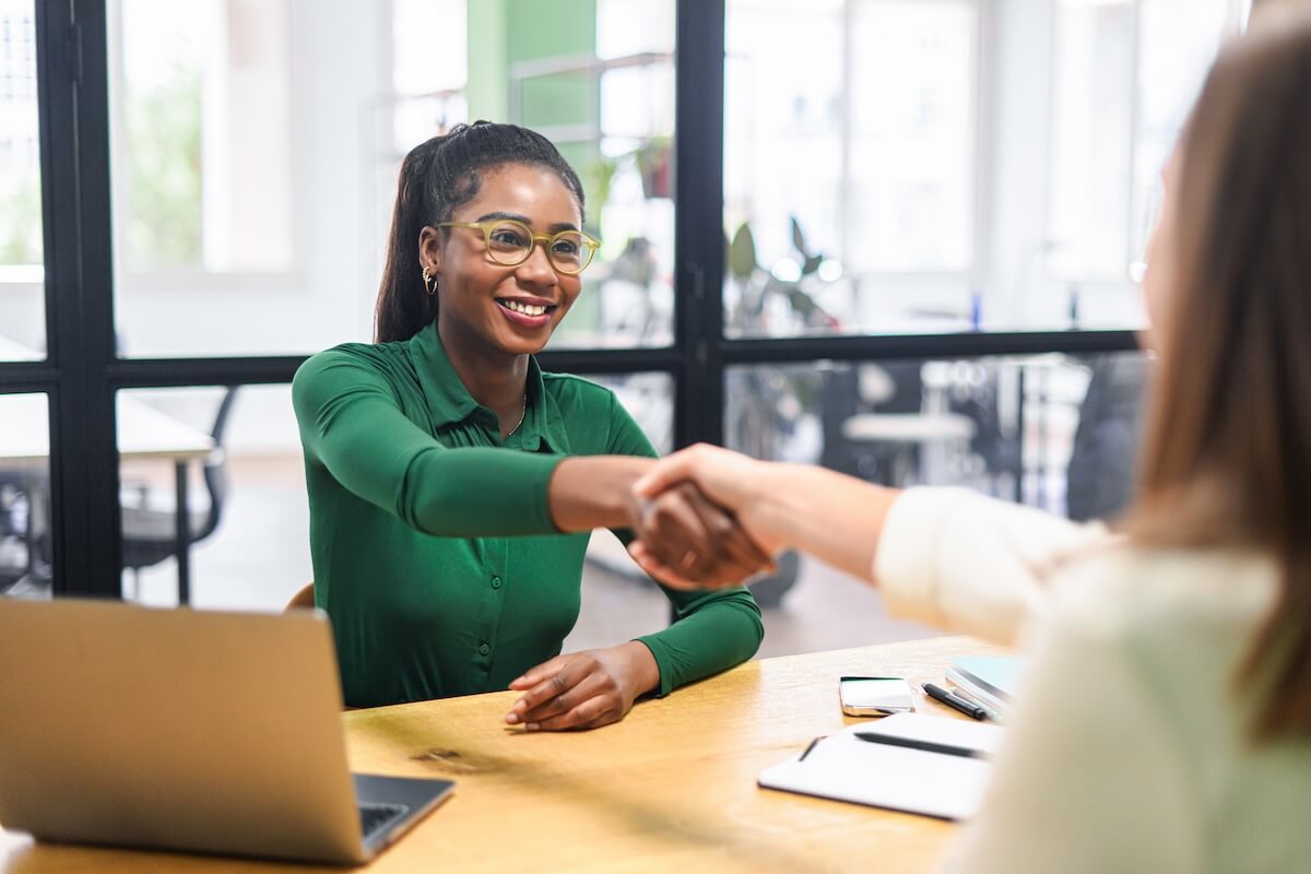 Recruitment and retention: HR manager shaking hands with an applicant