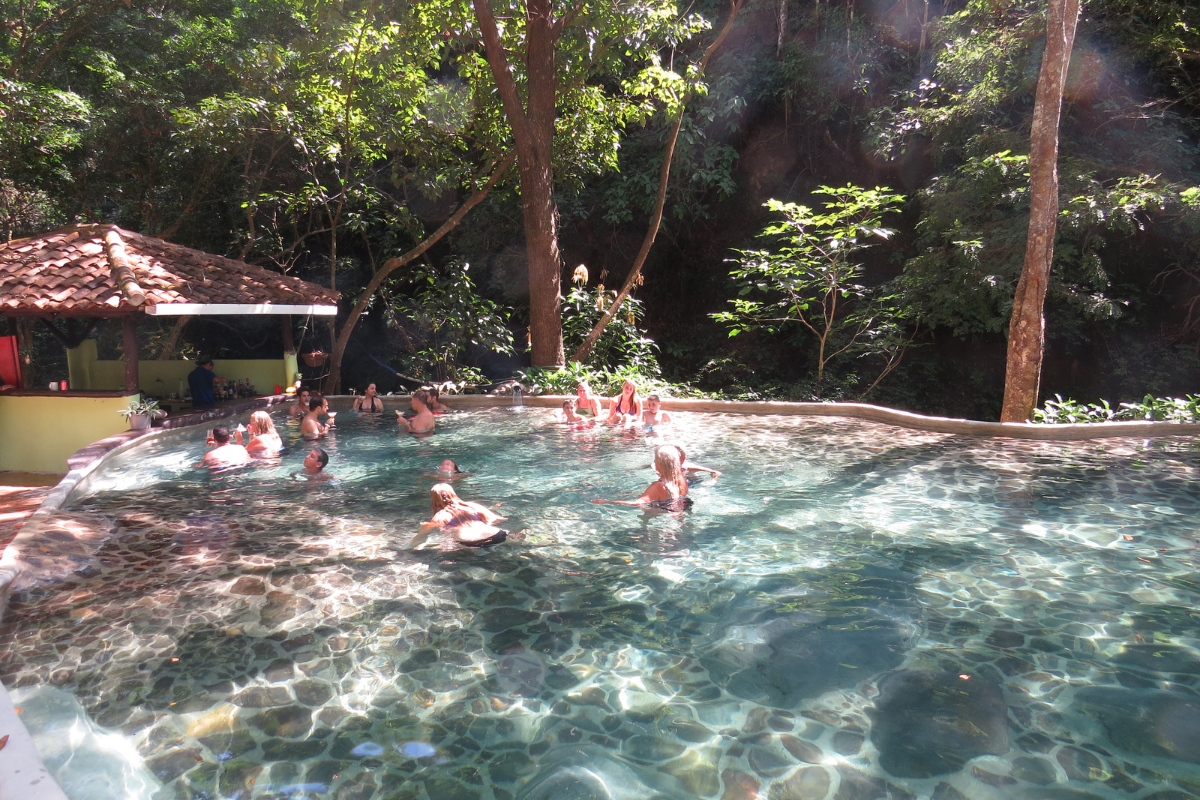 people enjoying in hot springs