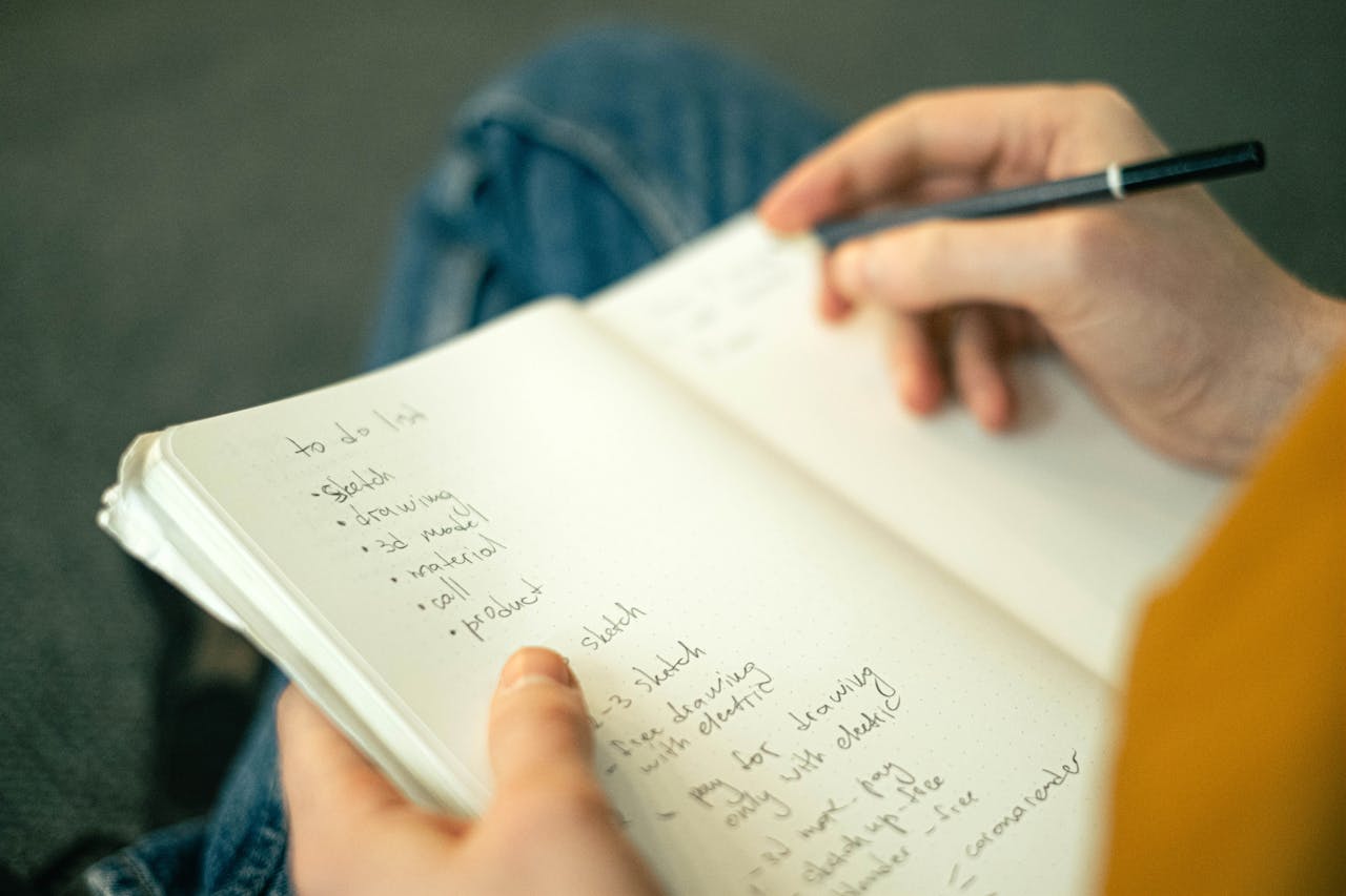 A man writing down his to-do-list