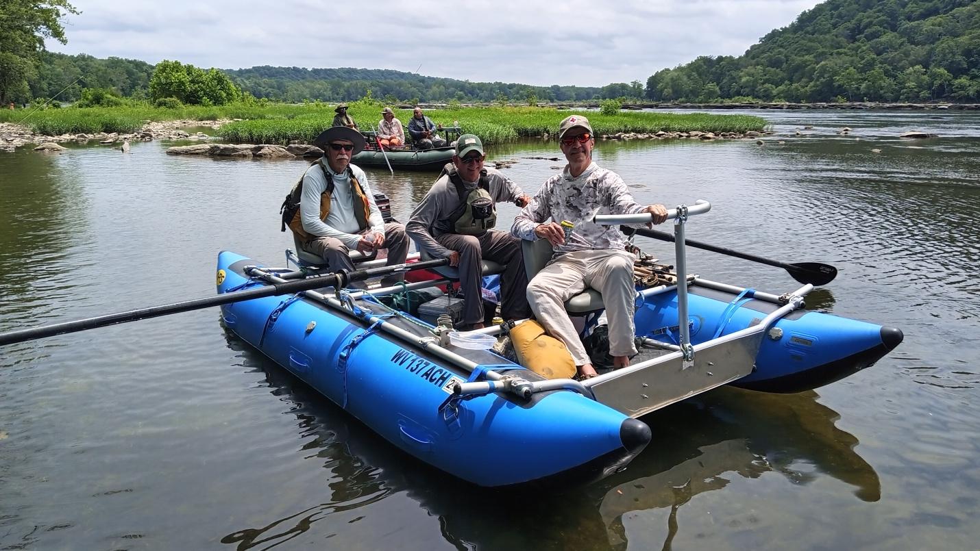 A group of men on a raft

Description automatically generated