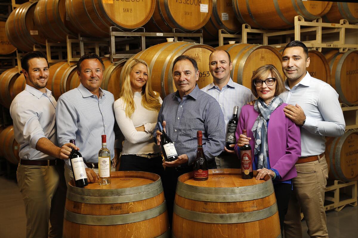 Chris Riboli, left, Steve Riboli, Lisa Riboli-Elzholz, Santo Riboli, Anthony Riboli, Cathy Colombatti and Dante Colombatti are part of the Riboli family making Stella Rosa wines at the historic San Antonio Winery near downtown Los Angeles.