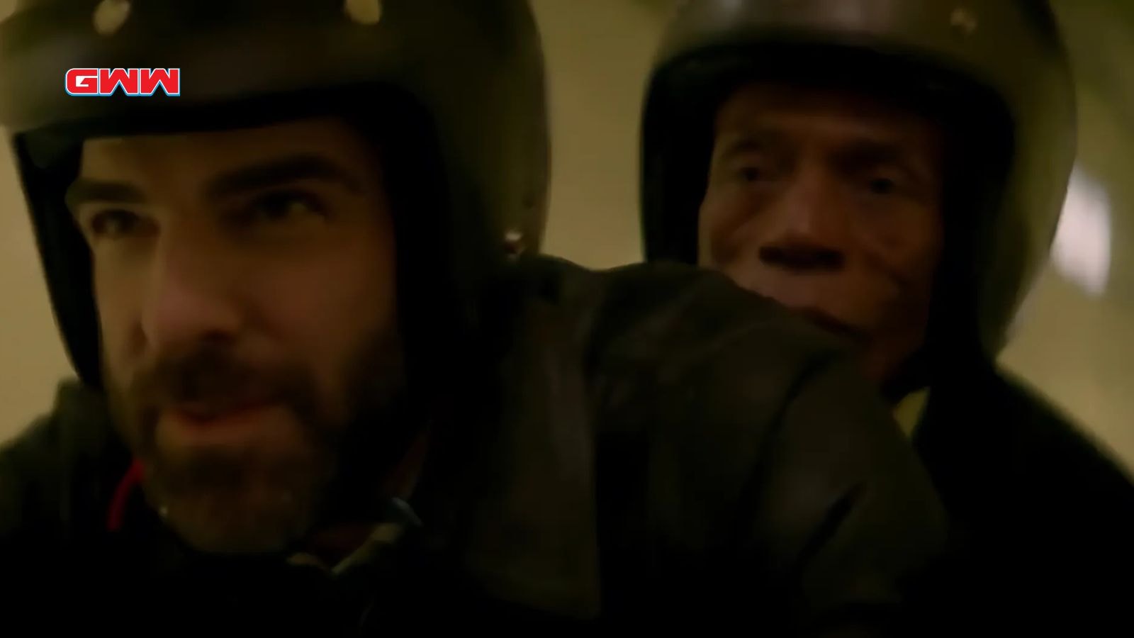 Dr. Oliver (Zachary Quinto) rides a motorcycle in a tunnel with a passenger