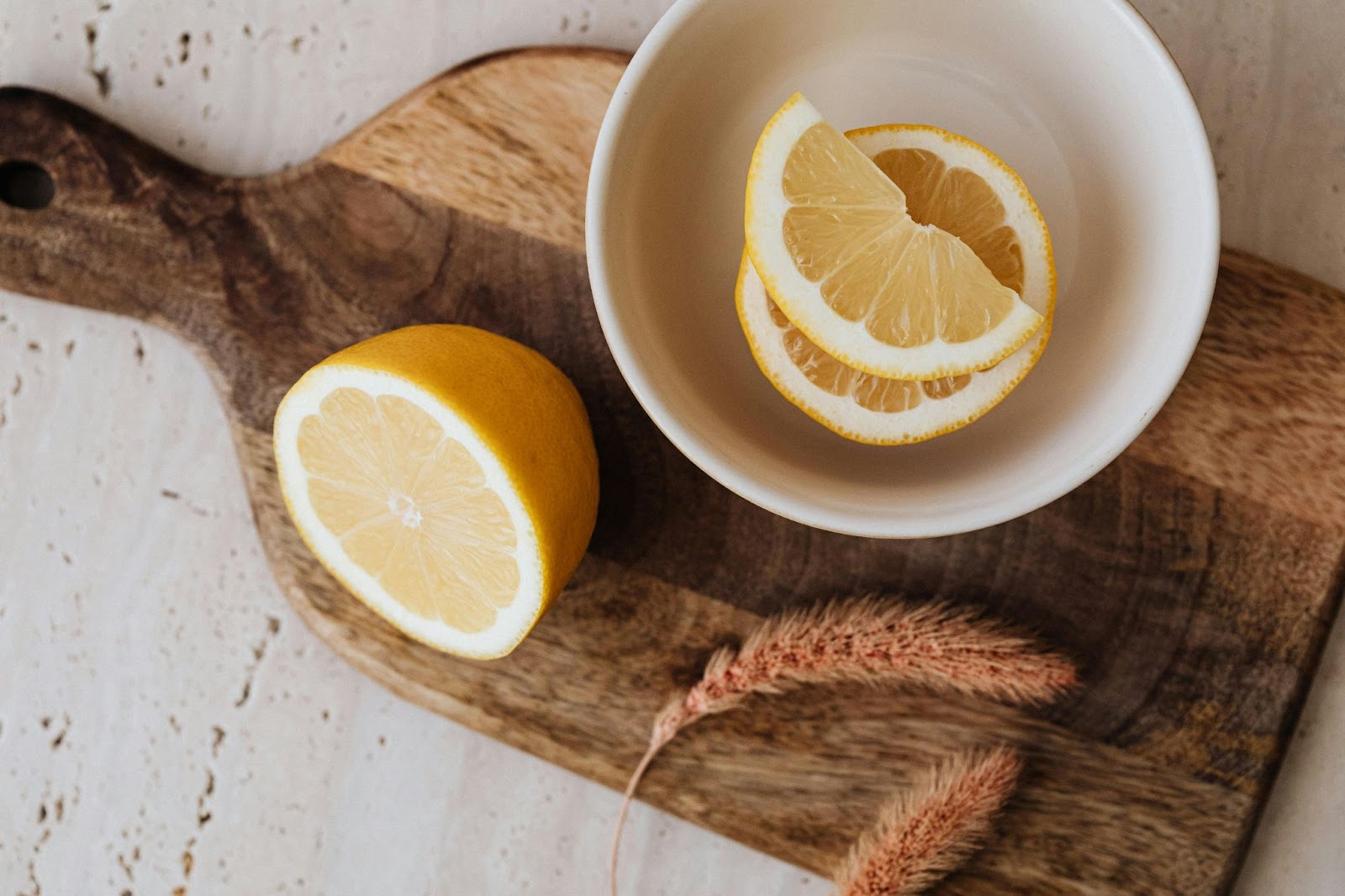 Sliced Lemon on a Brown Wooden Chopping Board