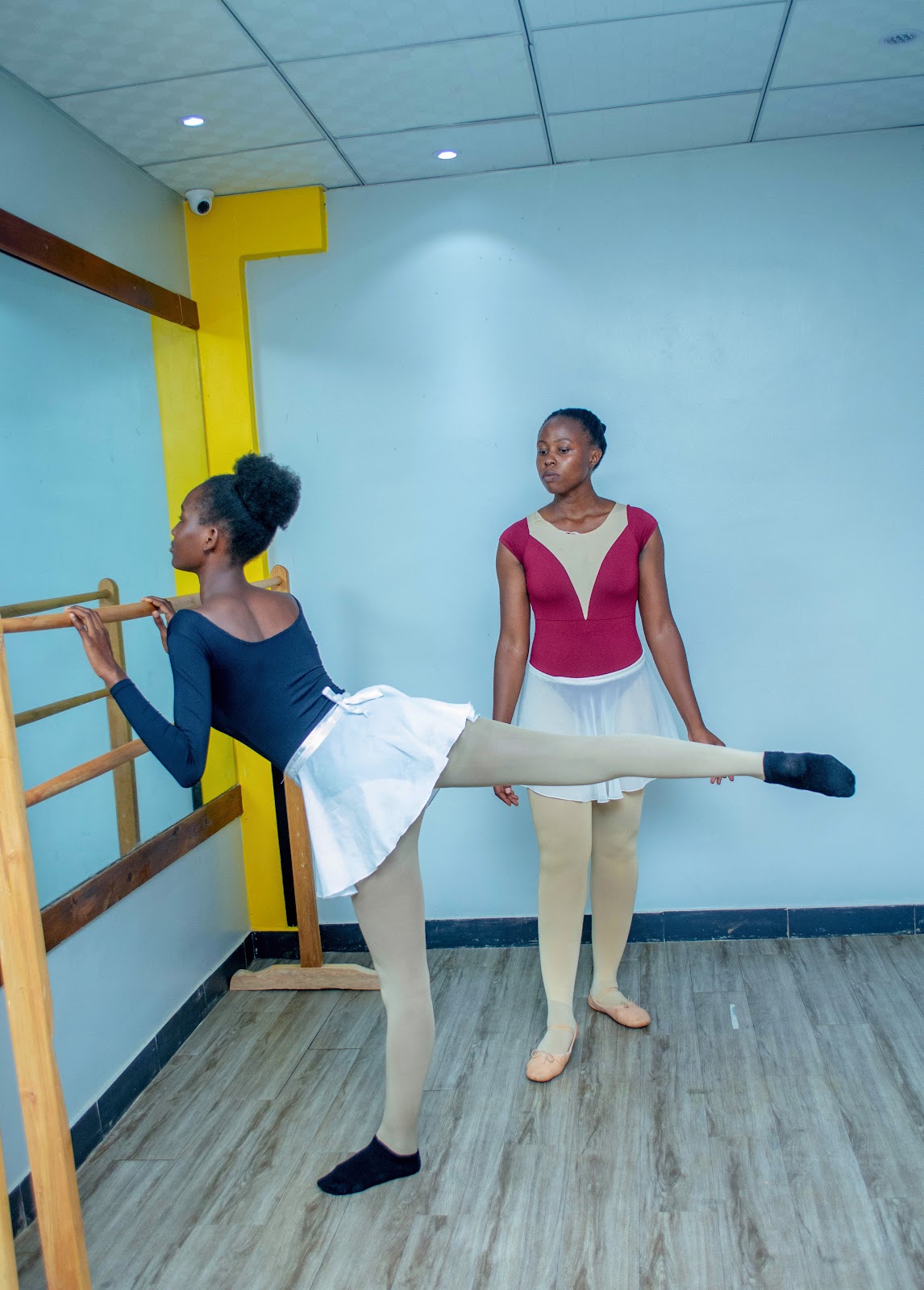 Ballet teacher at Leotard Ballet Academy training a student