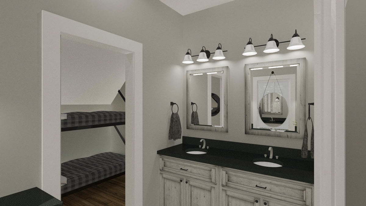 Off the bunkroom is a double sink vanity paired with marble mirrors and white sconces.