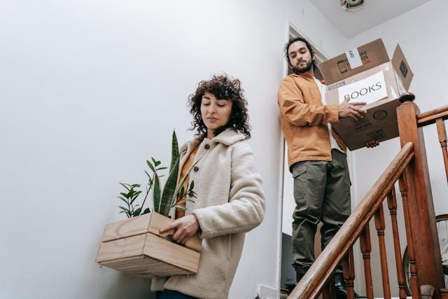 Couple carrying boxes