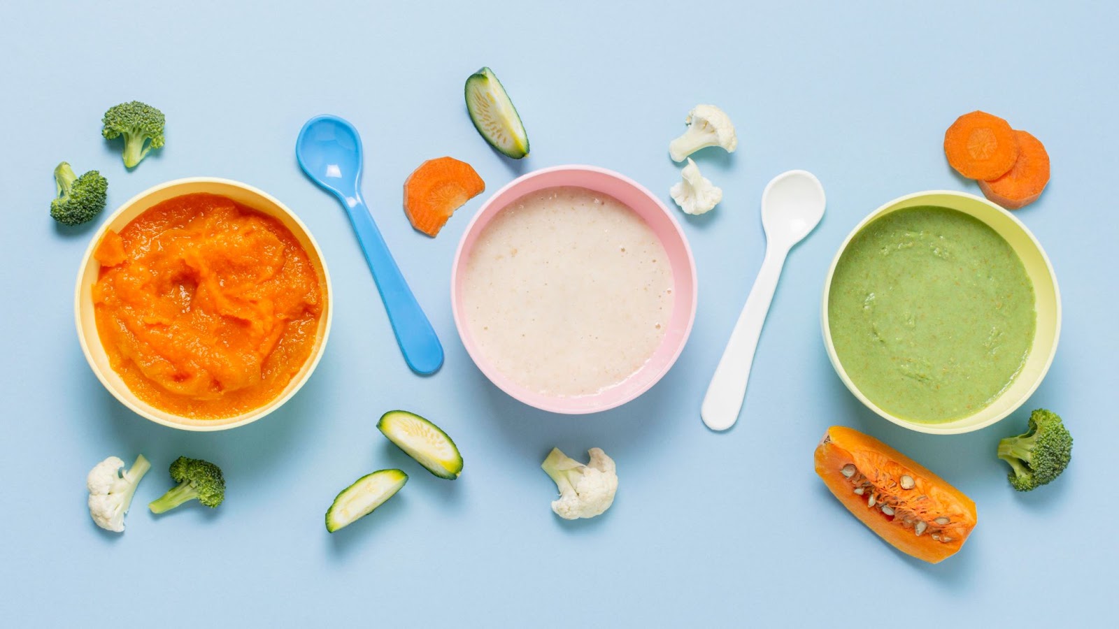 Baby food purees in three different bowls