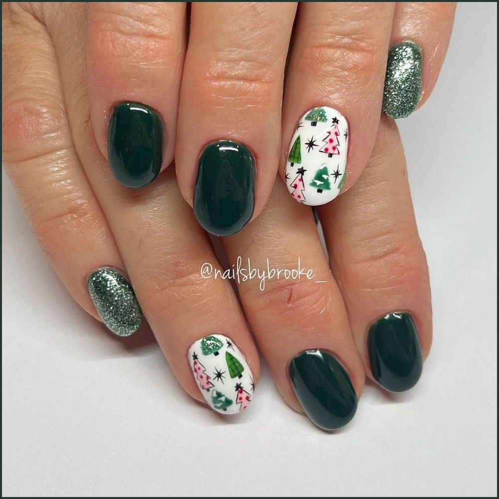 Close up of hands with Christmas Green Nails having  Christmas Tree Accent Nail