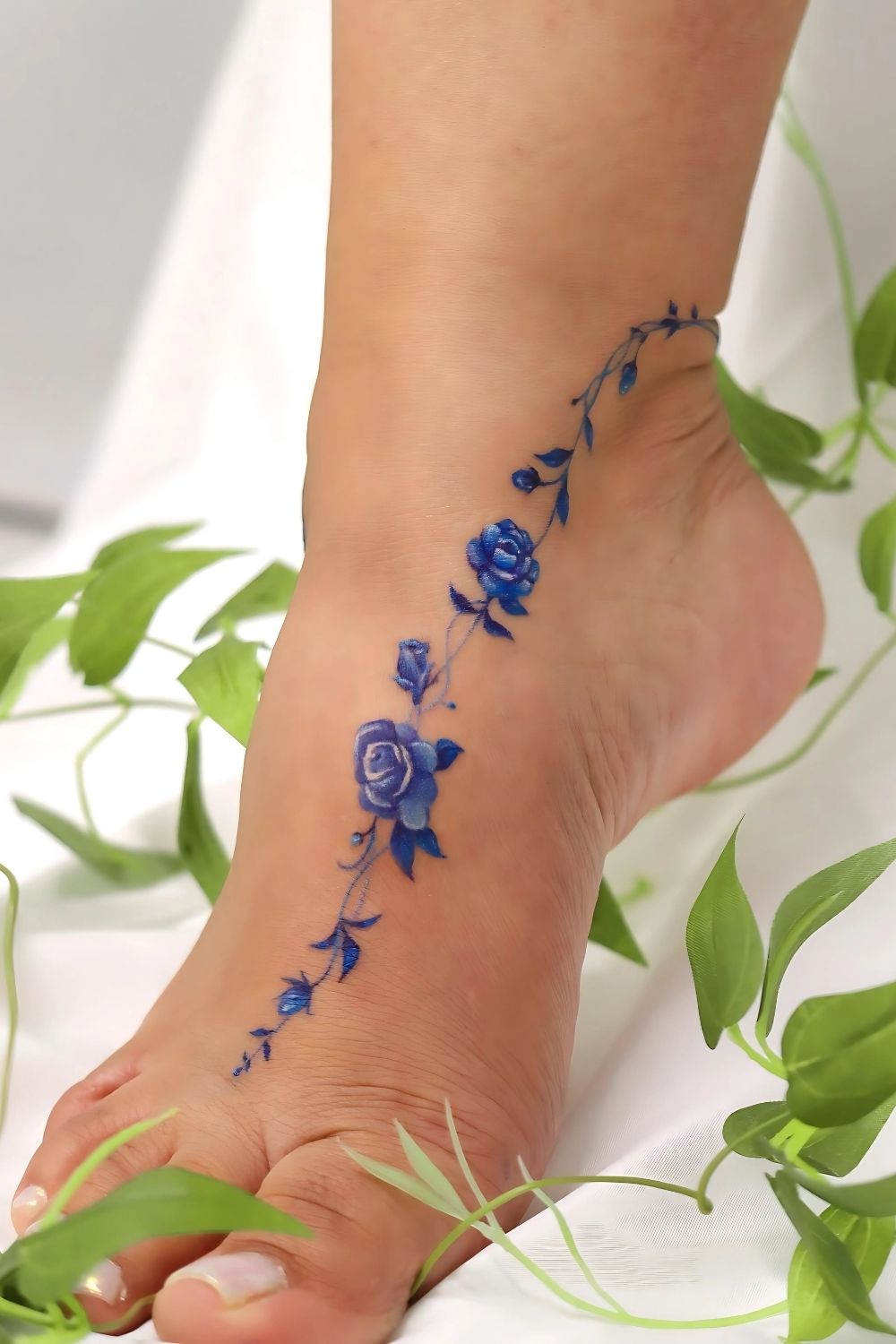 Small Blue Rose Foot Tattoo