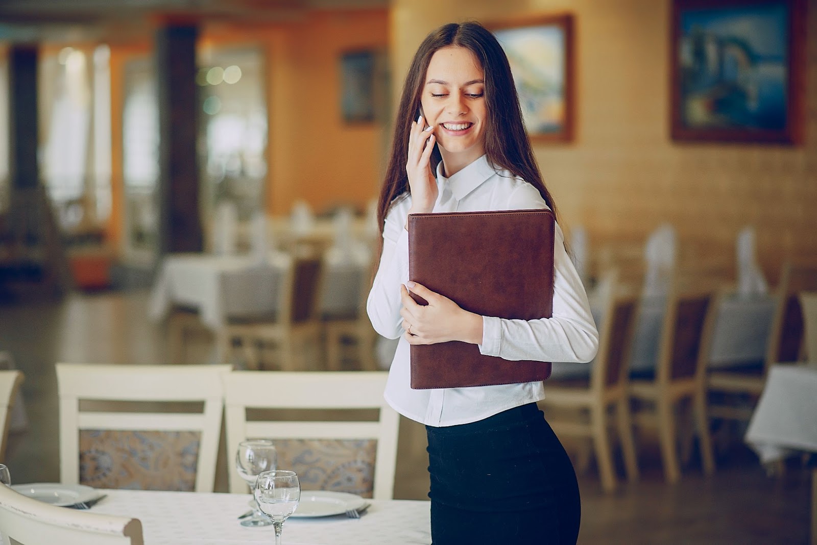 woman standing talking on phone 