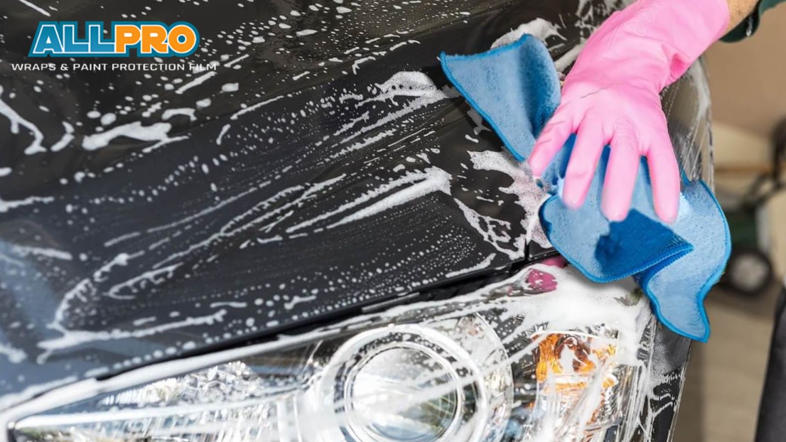 Two-bucket wash method used to rinse and wash a ceramic-coated car, preventing scratches