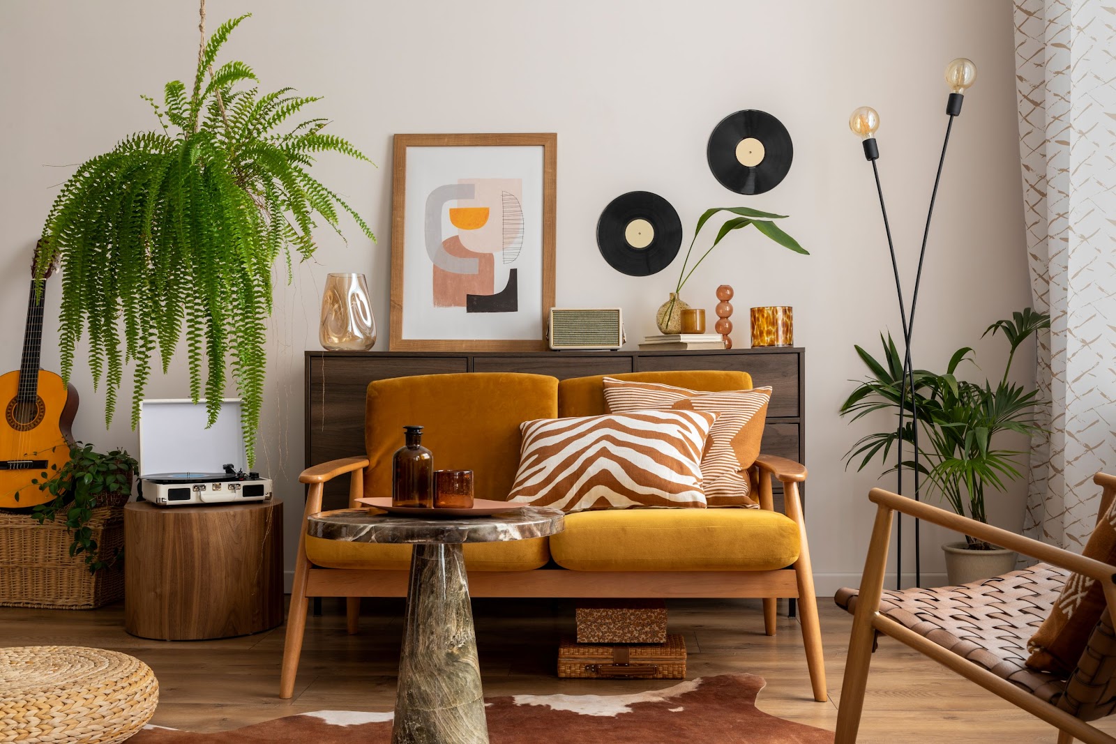 Colourful retro style living room with yellow sofa and eclectic decor. 