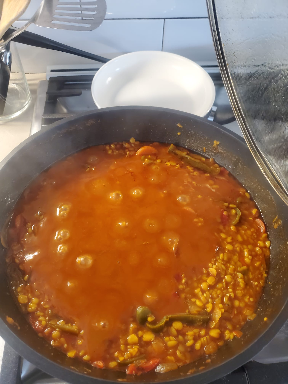 A stew simmers on a pan on the stove.