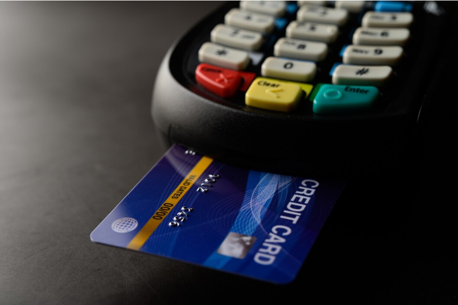 Credit card inserted into a payment terminal