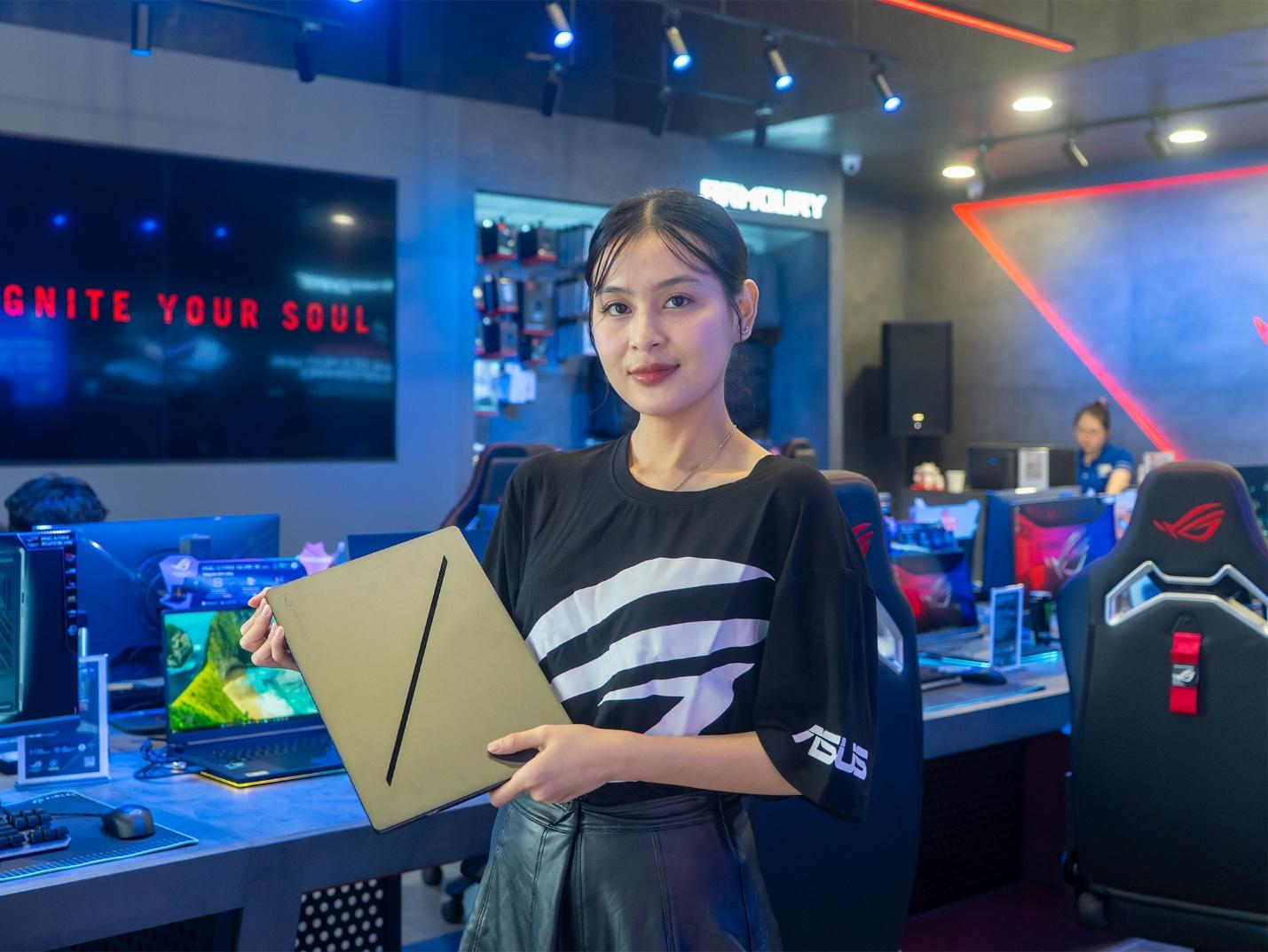 A person holding a tablet in a room with computers

Description automatically generated