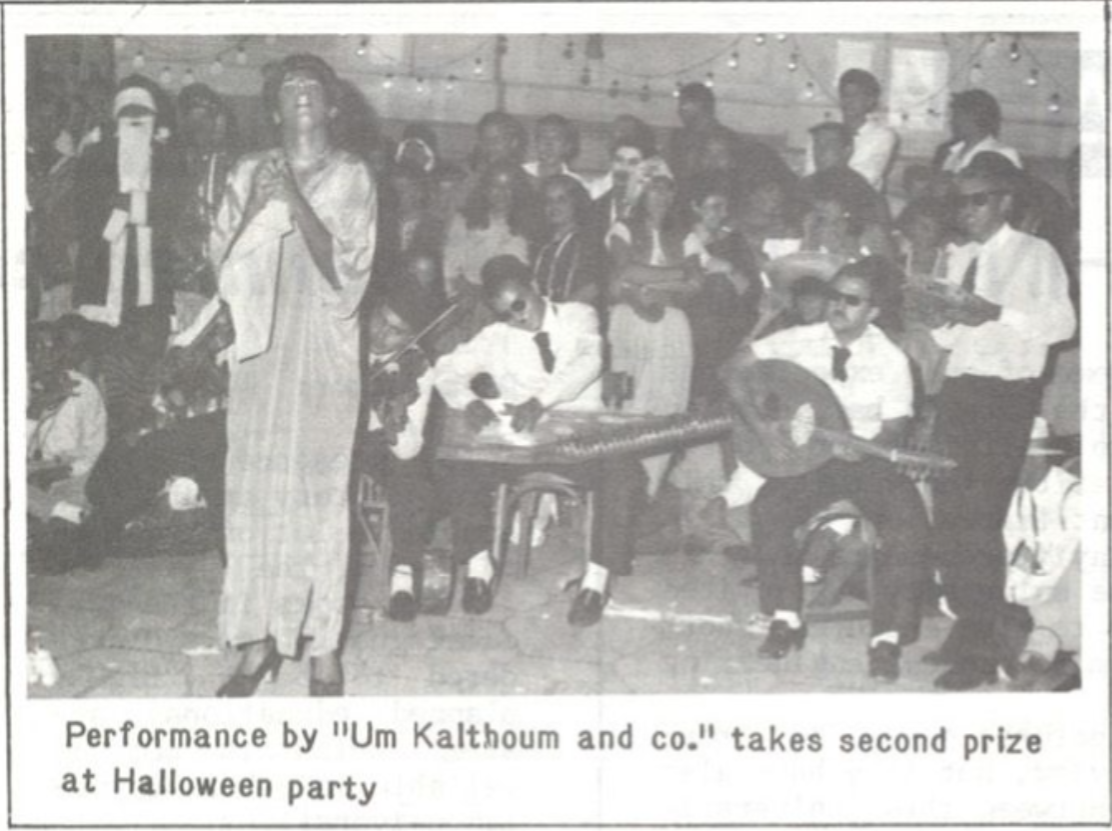 Photo of students appearing as a band, captioned "Performance by 'Um Kalthoum and co.' takes second prize at Halloween Party"