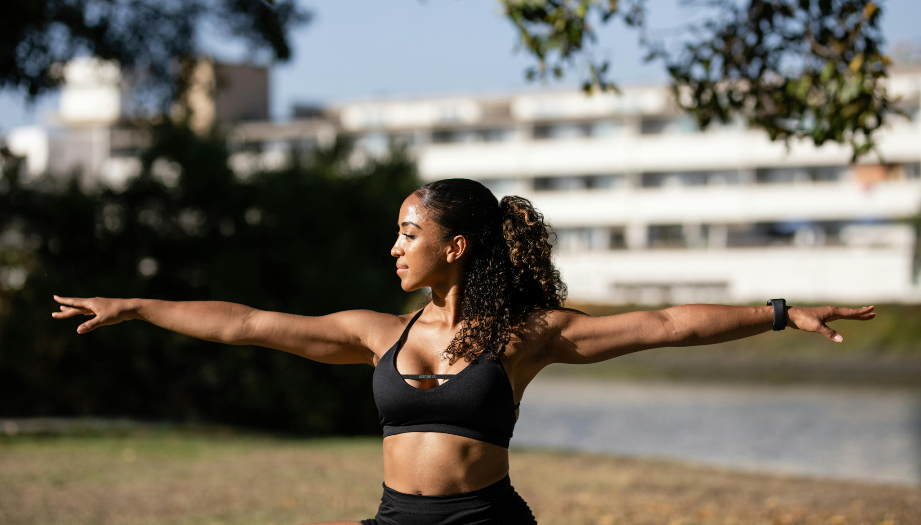 A person in a black sports outfit with her arms out

AI-generated content may be incorrect.