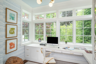 home addition office design features to boost your productivity sunroom workspace with long desk and large windows custom built michigan