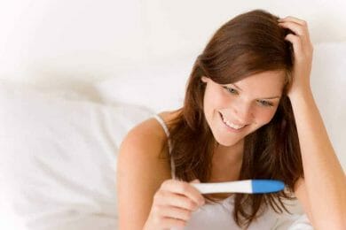 A woman takes a pregnancy test