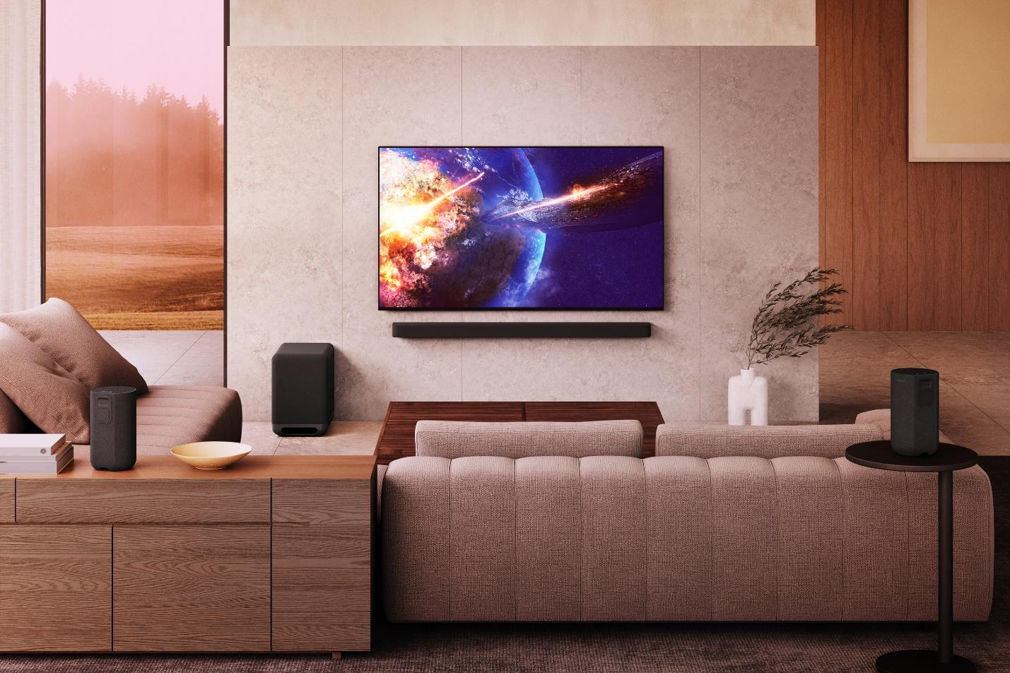 A living room with a television on the wallDescription automatically generated