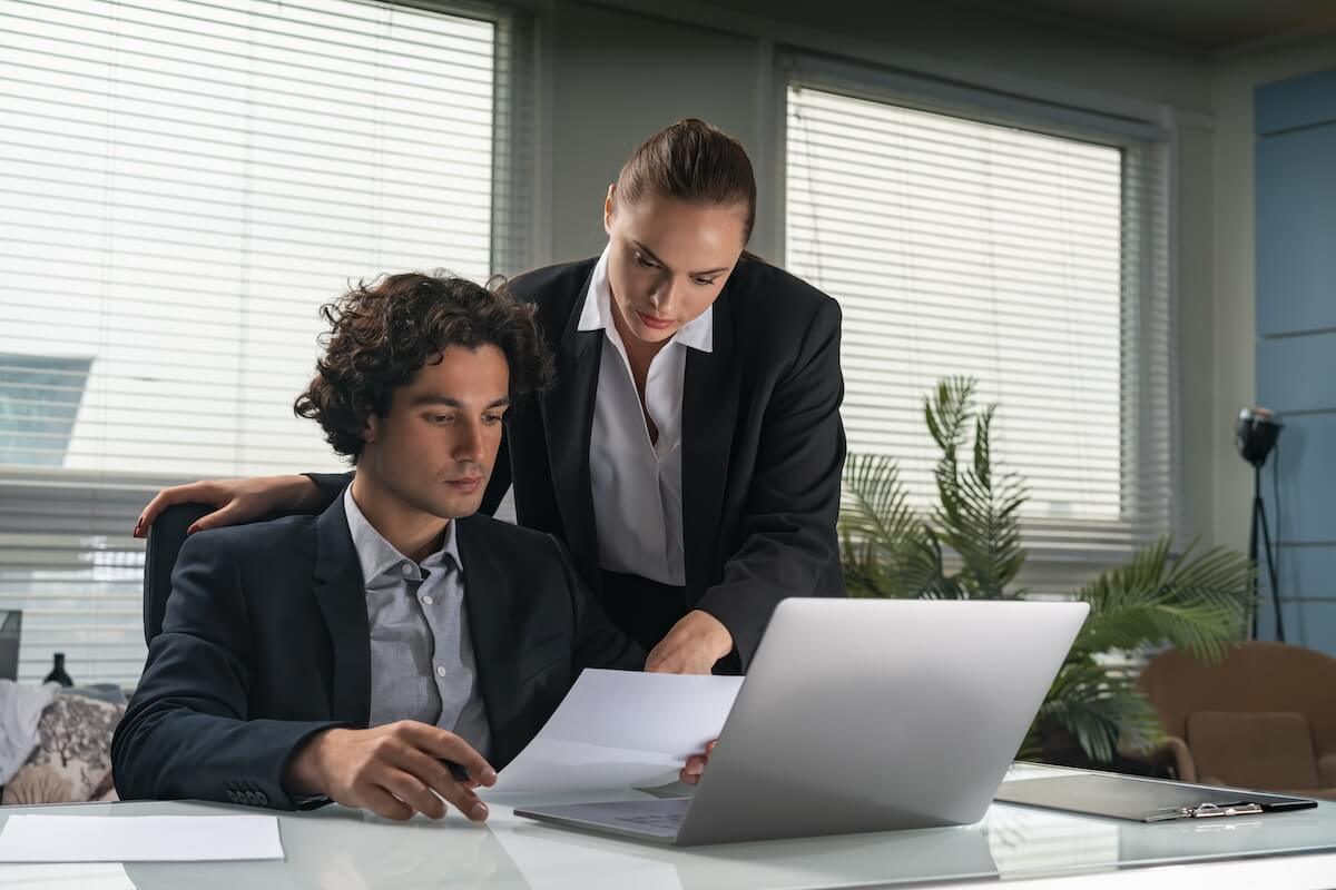 Talent management process: two HR employees reading a document