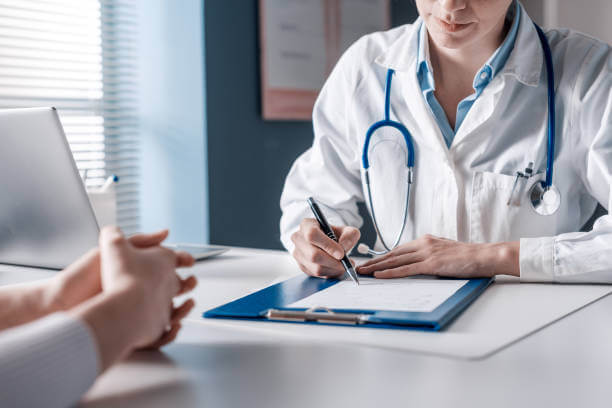 A patient discussing their health concerns with a functional medicine doctor in a calm, professional office setting.