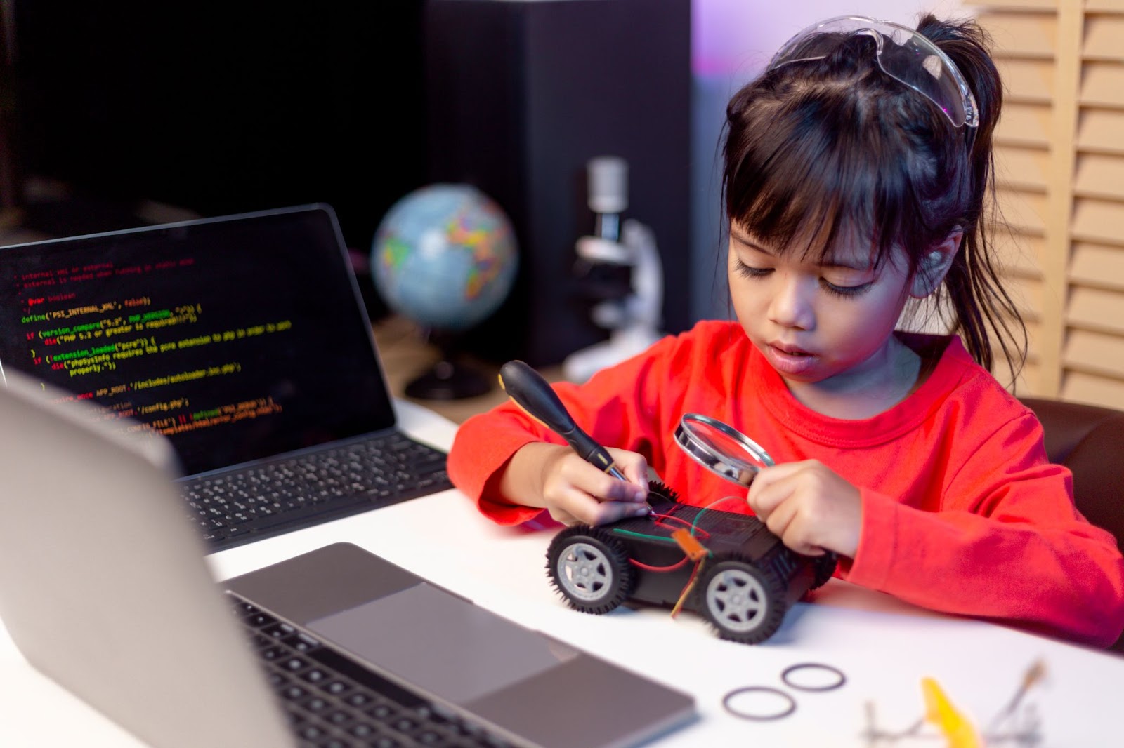 Child learning coding & robotics