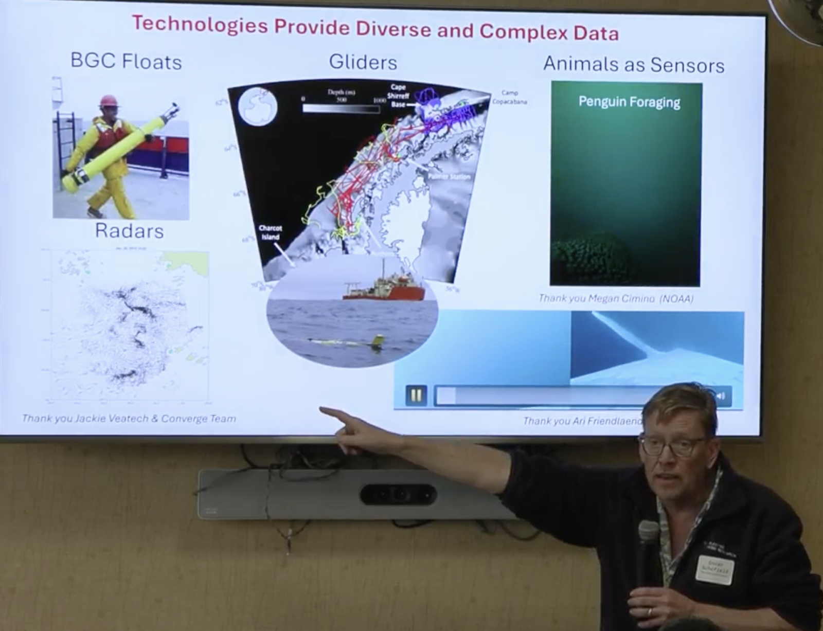 Professor Oscar Schofield using a slideshow and presenting on the future of environmental science in the dawn of AI
