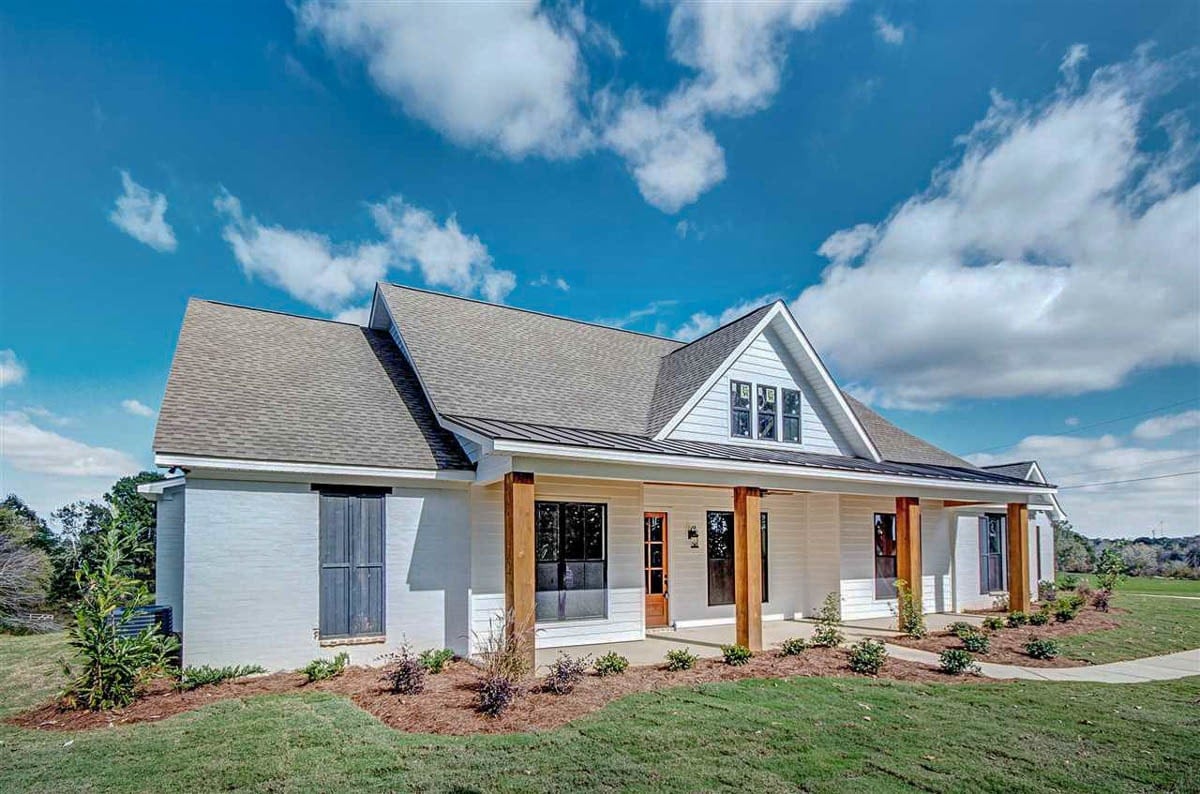 Front-left exterior view with covered porch topped by a center gable.
