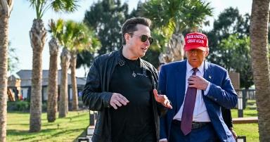 A person in a red hat and sunglasses walking next to a person in a suit

Description automatically generated