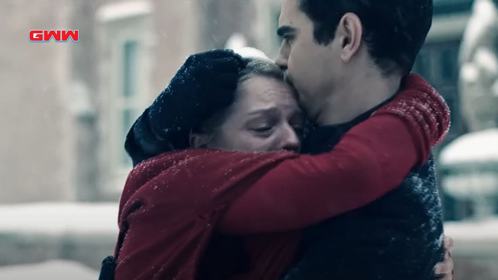 June Osborne and Luke embrace emotionally in a snowy setting from Season 6.