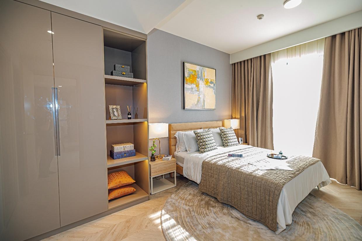 A bedroom with a bed and a bookcaseAI-generated content may be incorrect.