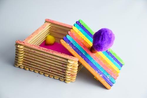 Free Building a Box from Colorful Craft Sticks Stock Photo