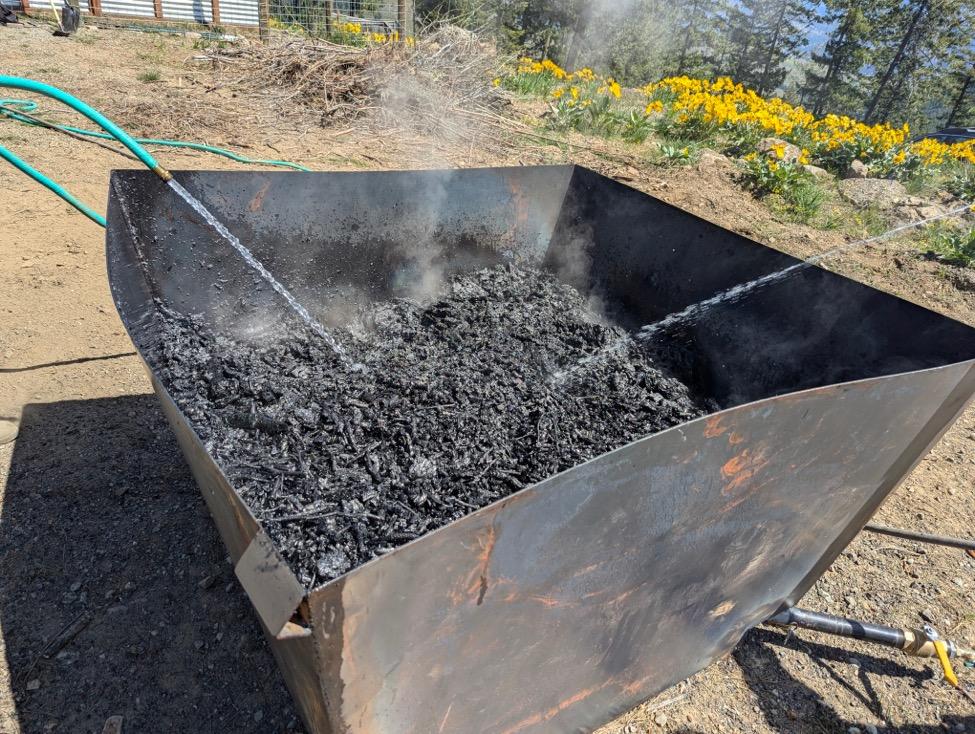 A large metal box with smoke coming out of it

AI-generated content may be incorrect.