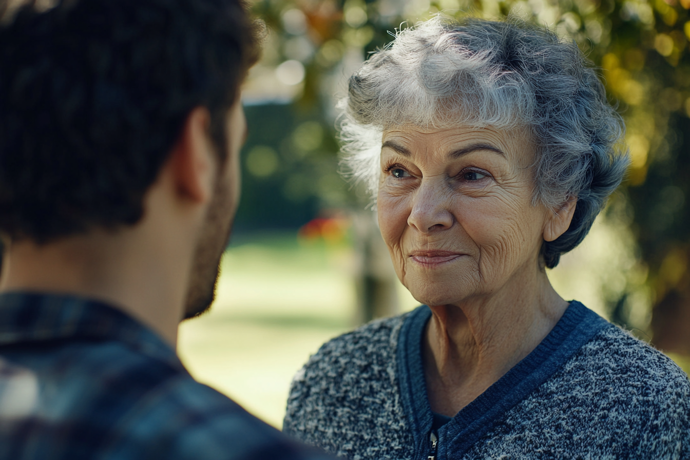 An older woman talking to a man | Source: Midjourney