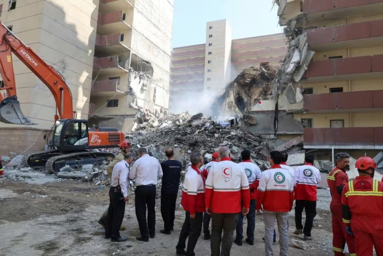In this photo released by the Iranian Red Crescent Society, rescuers work at the scene of an explosion after an Israeli strike in Tehran, Iran, on 13 June 2025. Photograph: AP