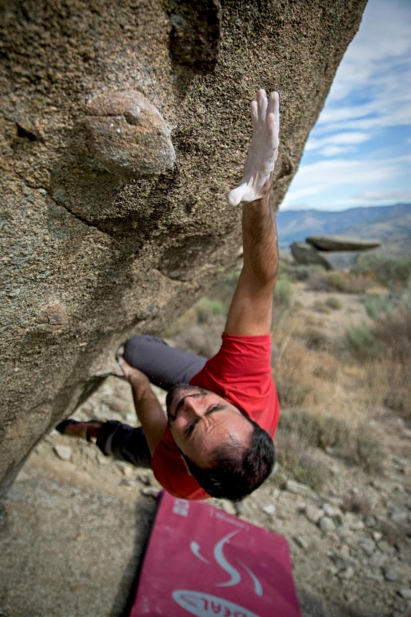 Free Man Climbing on Gray Concrete Peak at Daytime Stock Photo