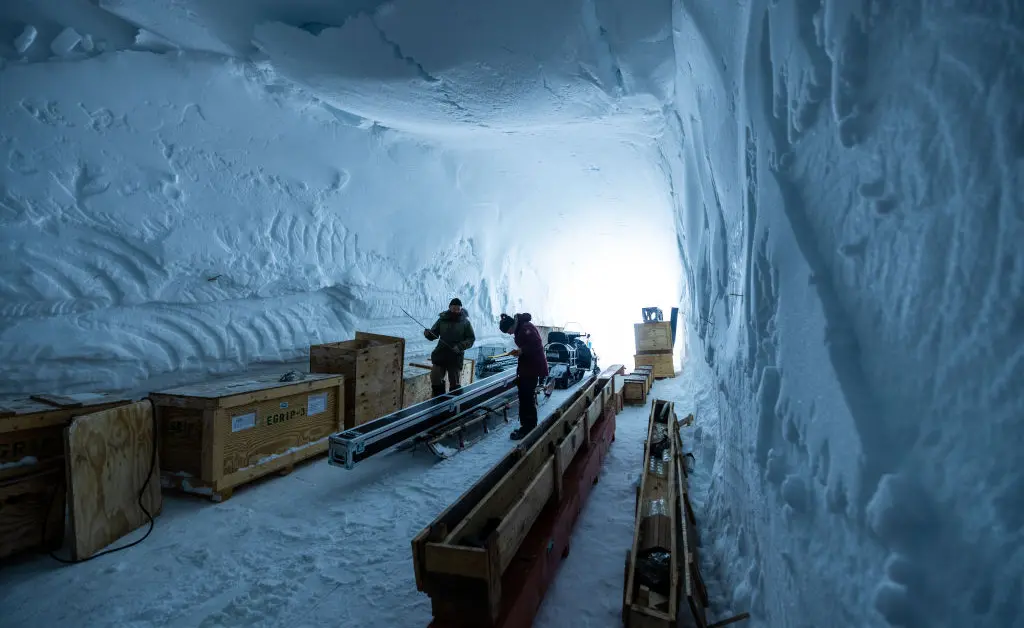 researchers with ice from the bottommost layers