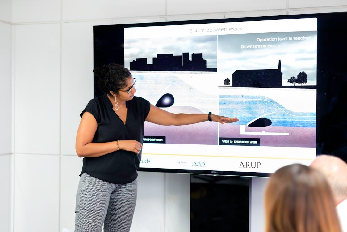 Free Female Engineer Holding Presentation Stock Photo