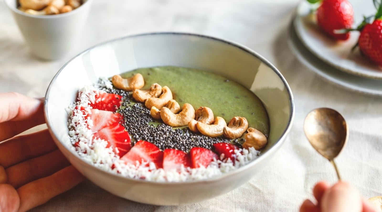 Green smoothie bowl from a family-friendly healthy restaurant in Toronto, recommended by a nutritionist