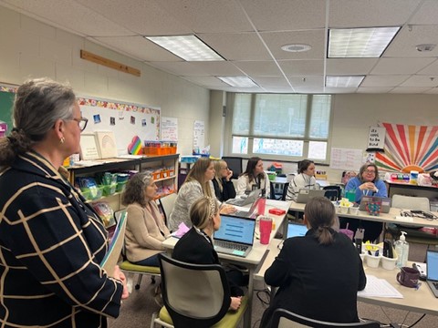 Dr. Reid observing a teacher planning session at Kings Park Elementary School. 