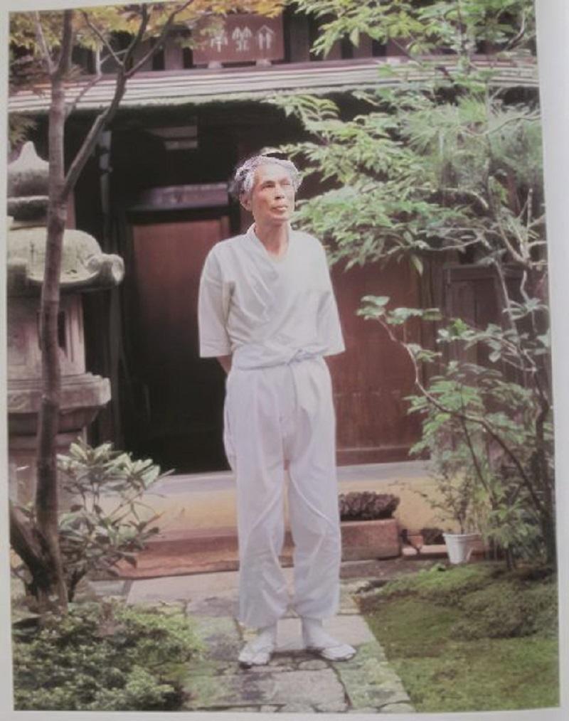 Sumitani standing in his garden