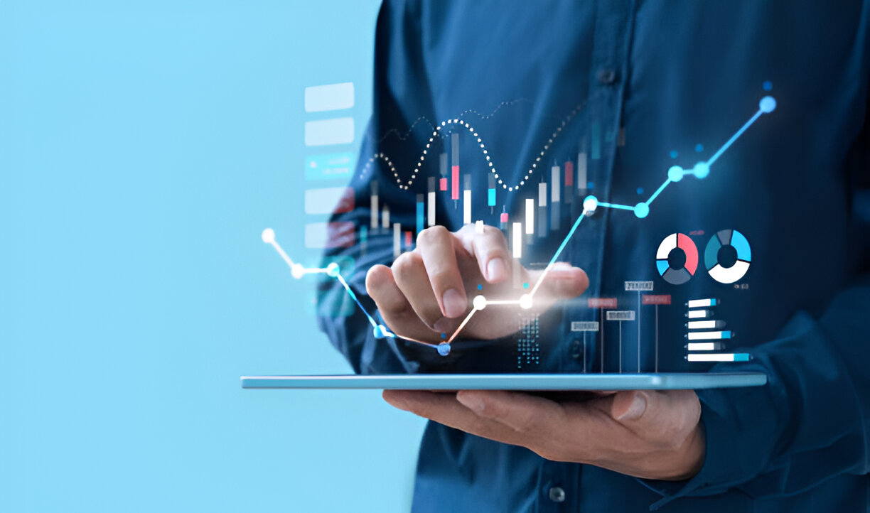 Business professional performing trend analysis on a tablet, with digital charts and graphs visualizing data trends.