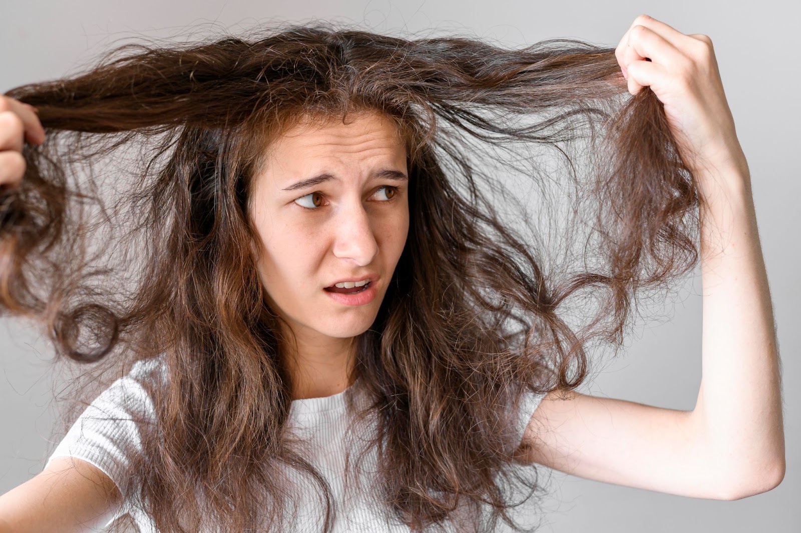 A woman with over-processed and damaged hair.